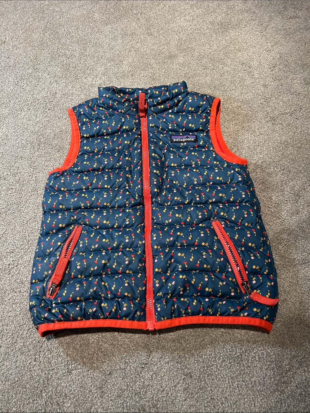 Patagonia Navy Puffer Vest with Red Trim and Multicolor Dot Print